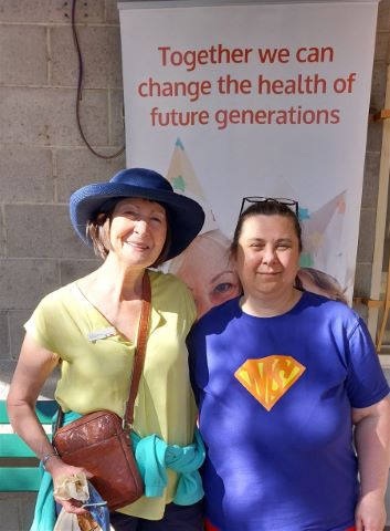 Allie in a superhero costume with an MS logo at the Galston500